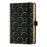 Elegant pocket notebook with gold detailing, ivory pages, and soft-touch cover, perfect for stylish note-taking on the go.