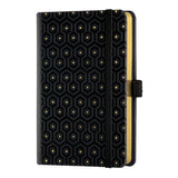 Elegant honeycomb embossed notebook with gold accents, ivory ruled pages, and a triangular black and gold pencil accessory.