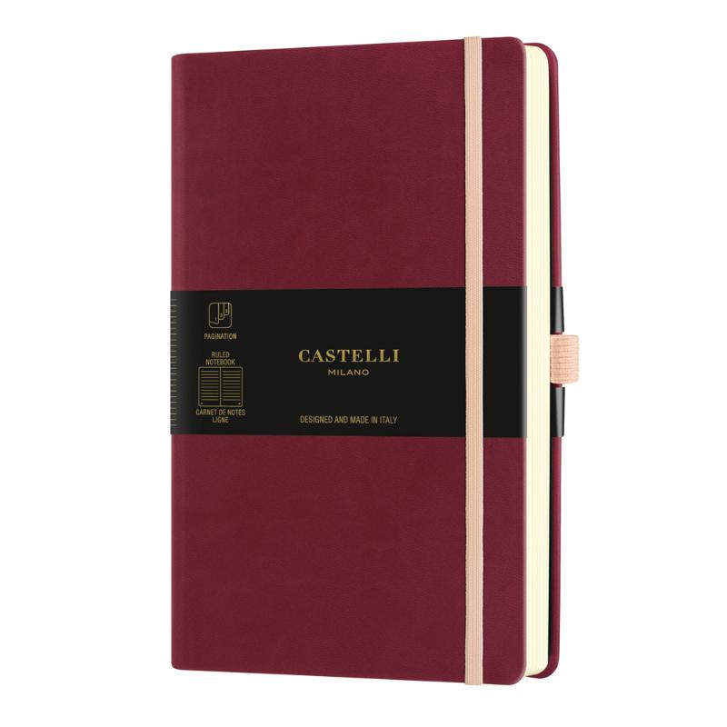 A5 ruled notebook in Black Cherry with elastic closure, ribbon marker, and eco-friendly features, ideal for writing and organization.