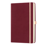 Luxury Castelli A5 ruled notebook in Black Cherry with elastic closure, ribbon marker, pen loop, and eco-friendly design.