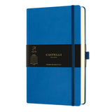 Stunning blue A5 ruled notebook with elastic band, ribbon marker, and expandable pocket for organized note-taking.