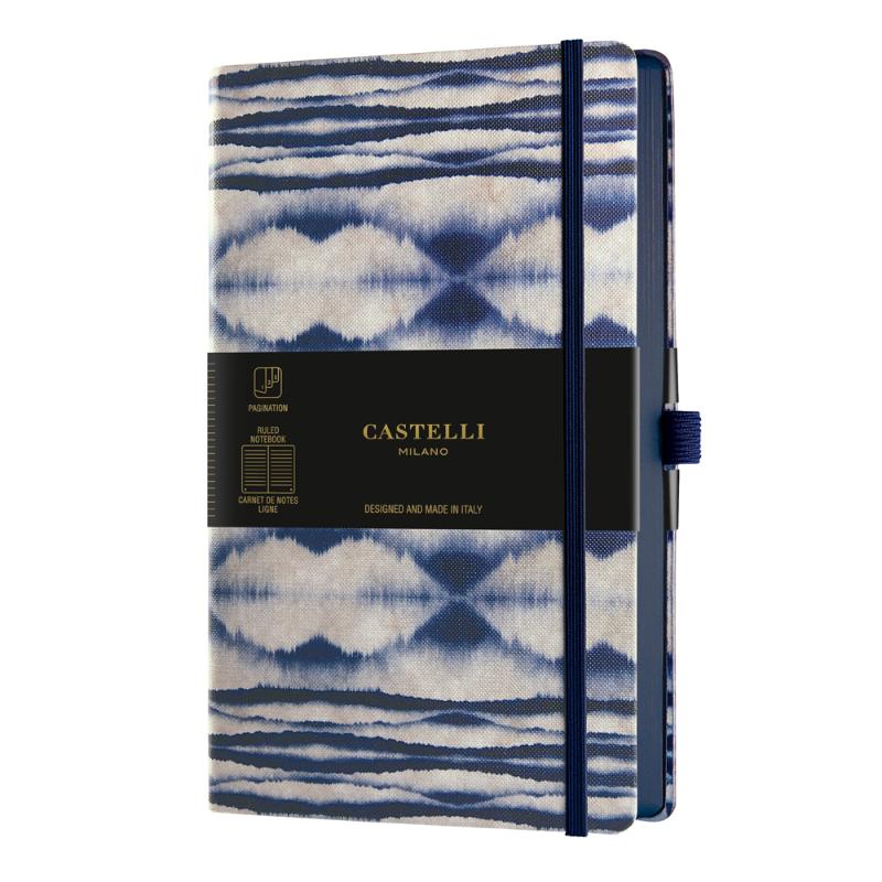 A5 ruled notebook with a stunning blue Shibori design, eco-friendly materials, and a convenient ribbon marker.