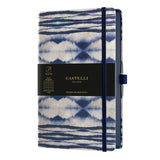 A5 ruled notebook with a stunning blue Shibori design, eco-friendly materials, and a convenient ribbon marker.