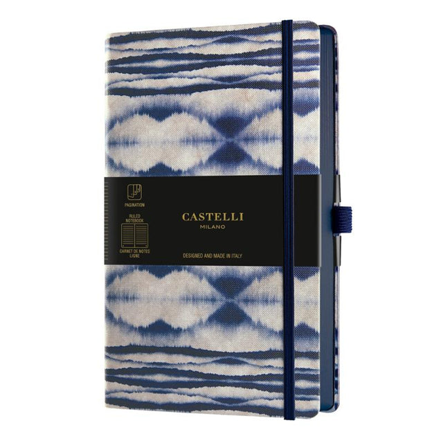 A5 ruled notebook with a stunning blue Shibori design, eco-friendly materials, and a convenient ribbon marker.