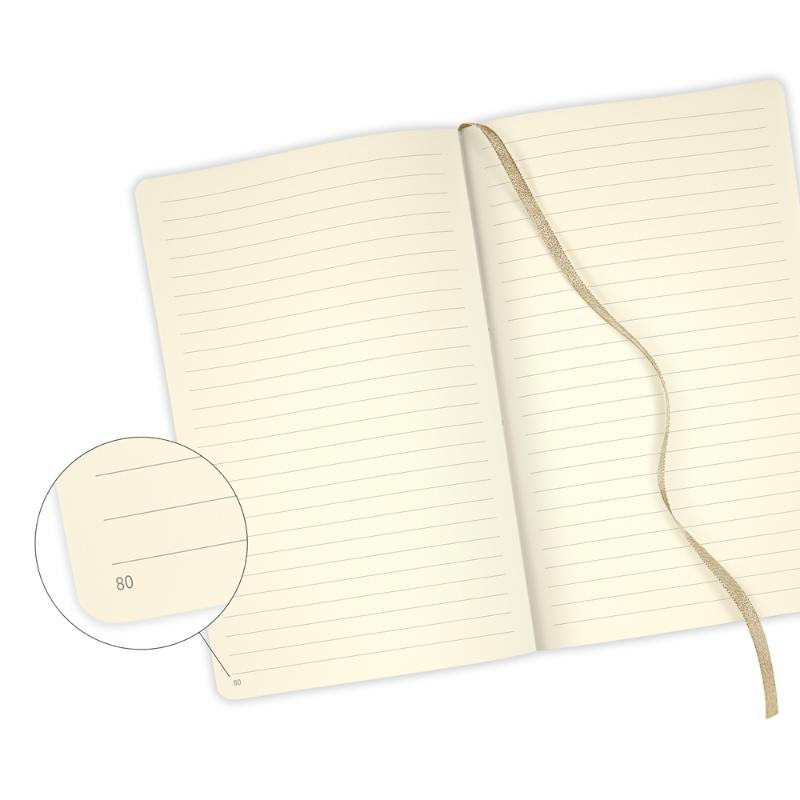 Elegant A5 ruled notebook with geometric design, metal accents, gold ribbon marker, and eco-friendly features.