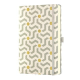 Luxurious Castelli A5 ruled notebook with geometric designs, gold accents, ribbon marker, and eco-friendly FSC certification.