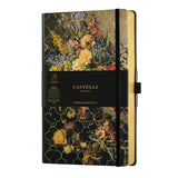 A5 ruled notebook in vintage rose with floral design, gold detailing, ivory pages, and gold page edges for luxurious writing.