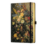 A5 ruled notebook in vintage rose with floral design, gold detailing, and luxurious edges, perfect for writing and organizing notes.