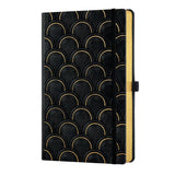 Elegant A5 ruled notebook with copper and gold design, embossed cover, and sustainable ivory pages for organized writing.