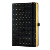 Elegant A5 ruled notebook with honeycomb embossed gold cover, ivory pages, and a luxury black and gold pencil accessory.