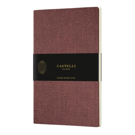 Castelli Quaderno A5 notebook in Harris Red, featuring soft cover, ivory ruled pages, and eco-friendly materials, made in Italy.