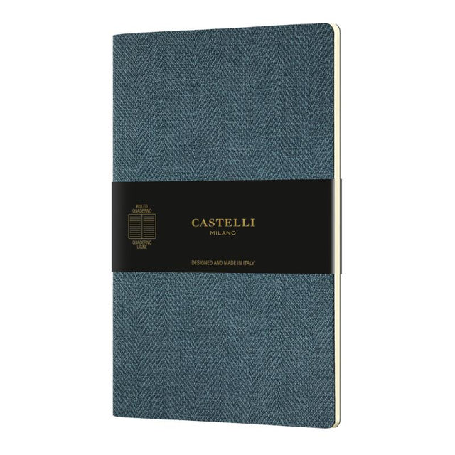 Elegant Castelli Quaderno A5 notebook in Harris Blue with flexible cover and smooth ivory pages, perfect for writing and sketches.