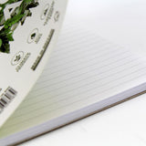 Eco-friendly Silvine A5+ notebook with 120 ruled pages, twin wire binding, and perforated tear-out options.