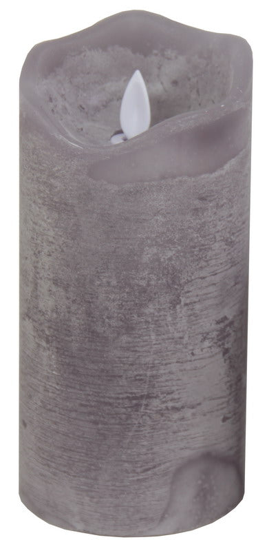 Large grey LED wax candle with realistic moving flame effect, emitting warm yellow light for a cozy ambiance.