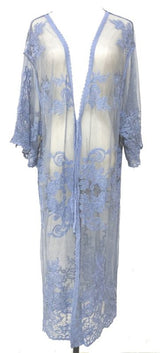 Elegant blue lace cape made of 100% cotton, perfect for layering with a flattering fit and sophisticated drape.