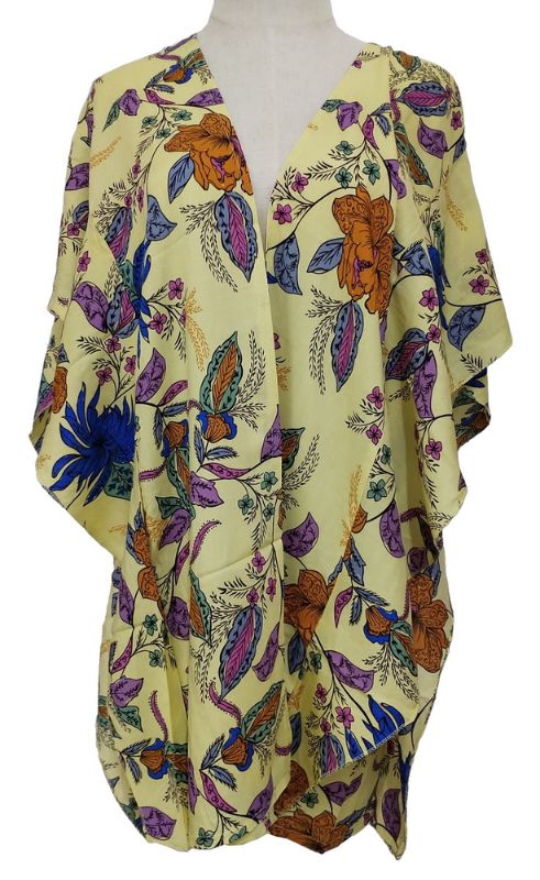 Stylish yellow Victoria Ruffled Side Cape in viscose with elegant ruffles, perfect for layering and versatile for any occasion.