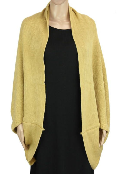 Beige dual-use shrug and scarf, made of 100% acrylic, stylish for layering and travel, perfect for any occasion.