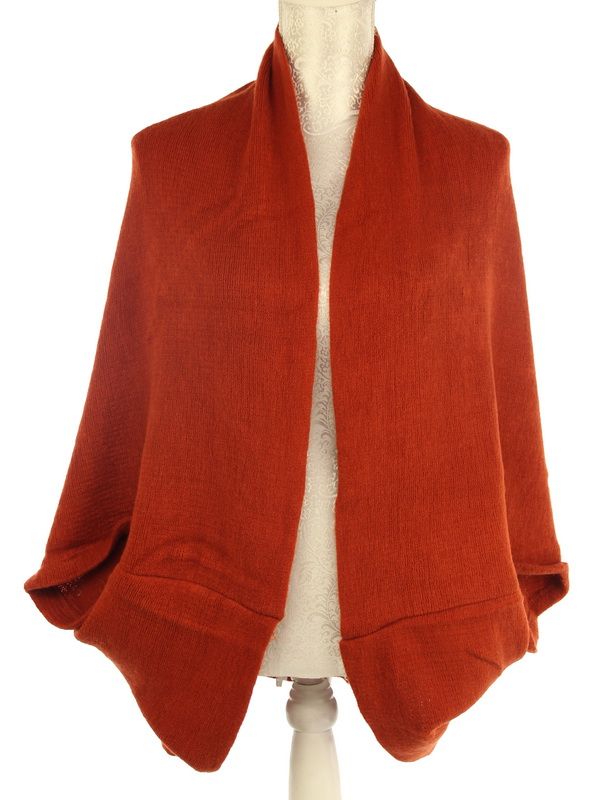 Versatile Laura Dual Use shrug and scarf in rich rust color, made of soft acrylic for style and warmth.