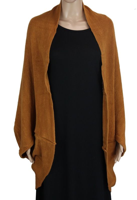 Toffee dual-use shrug and scarf in soft acrylic, perfect for layering and stylishly enhancing any outfit.