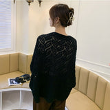 Elegant black crochet shrug in premium cotton, perfect for layering with any outfit for a stylish, sophisticated look.