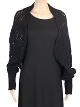 Elegant black crochet shrug made from 100% cotton, perfect for layering and adding style to any outfit.