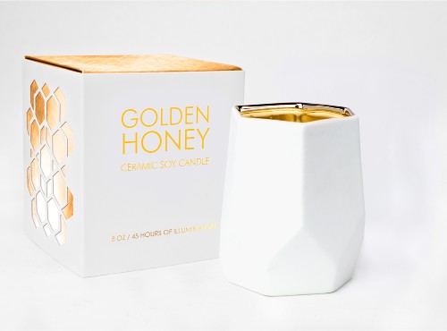 Abstract white candle with 75-hour burn time, infused with golden honeysuckle, garden rose, and hints of bergamot.