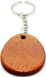 Set of 12 elegant goldstone keyrings, featuring gemstone and zodiac insights, promoting style and holistic well-being.