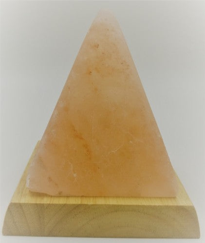 Orange pyramid-shaped Himalayan salt lamp, 10cm, promotes relaxation with a warm glow; includes USB adapter for easy setup.