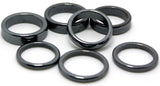A collection of 100 mixed-size Mini Hematite Rings showcasing a metallic sheen, ideal for jewelry making and holistic wellness.