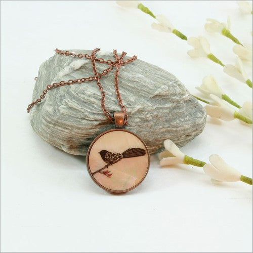 Elegant Circle Pendant Necklace featuring intricate filigree on genuine mother of pearl, ideal for both casual and formal styles.