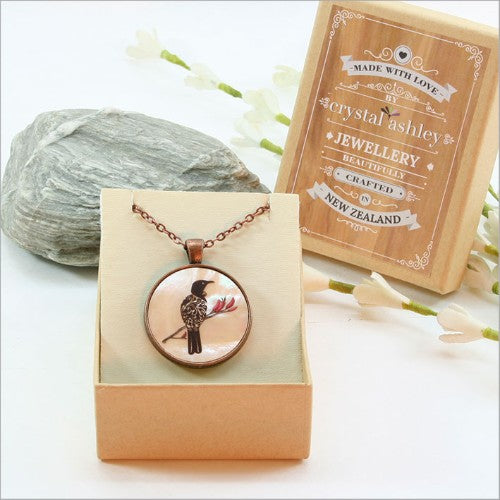 Elegant Circle Pendant Necklace featuring filigree Tui design on mother of pearl, with 30mm pendant and 75cm adjustable chain.