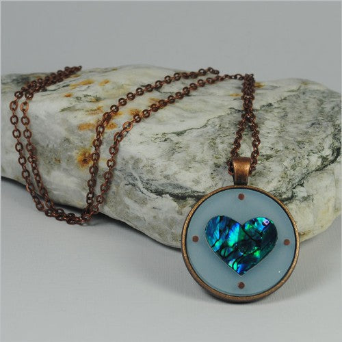 Circle Pendant Necklace featuring a vibrant Paua Heart Blue design, 30mm diameter, on a 75cm chain, ideal for any occasion.