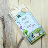 Whimsical space-themed growth chart ruler for tracking children's height; stylish wall decor and lasting keepsake.