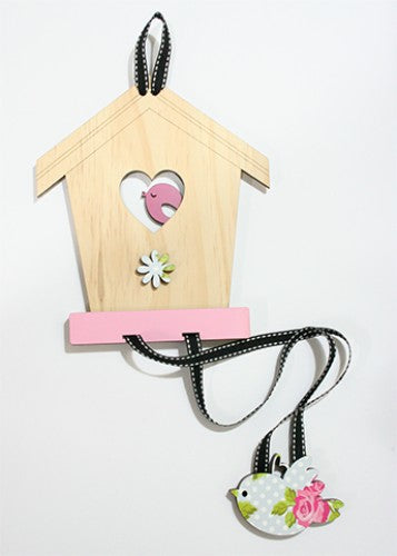 Charming birdhouse hairclip tidy made of pine and pink rose MDF, perfect for organizing accessories stylishly.