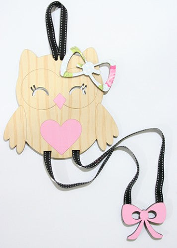 Charming owl-shaped organizer for hair accessories, keeping clips and pins neatly stored and easily accessible.