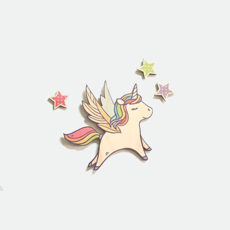 Whimsical pine wall art featuring a unicorn and stars, perfect for inspiring creativity in children's rooms.