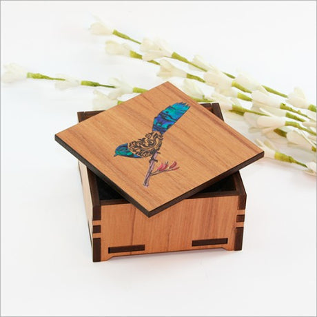 Elegant small trinket box with filigree design, NZ Silver Beech veneer, and vibrant paua inlay for keepsakes.