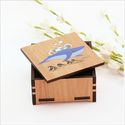 Charming small wooden trinket box featuring a whale design, perfect for storing jewelry and keepsakes.