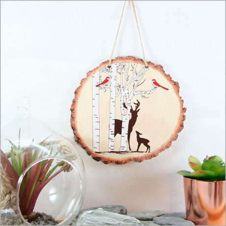 Beautiful wood slice wall art featuring a detailed deer in a serene woodland setting, crafted from durable 4mm veneer.