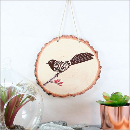 Beautiful wood slice wall art featuring the Filigree Fantail design, perfect for adding rustic charm to any room.