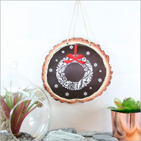 Intricate filigree wreath crafted from wood slices, perfect for adding natural elegance to any wall decor.