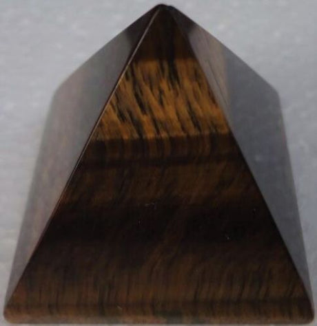 Small Tiger Eye pyramid, 3CM, showcasing golden-brown hues, promotes clarity and balance, ideal for meditation and decor.