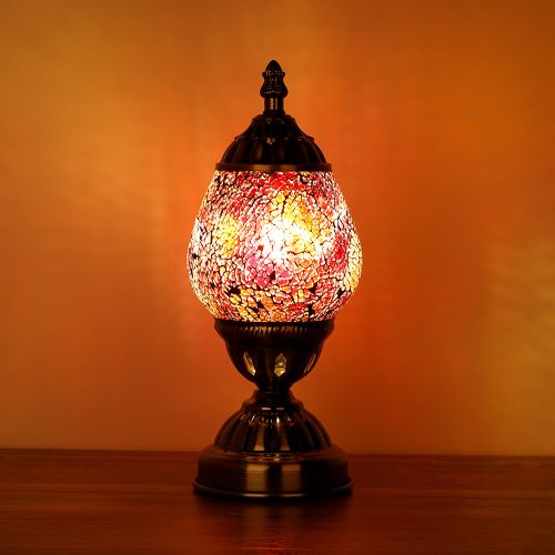 A 16cm Turkish Oval Mosaic Lamp in pink and orange, showcasing handcrafted artistry and an energy-efficient LED bulb.