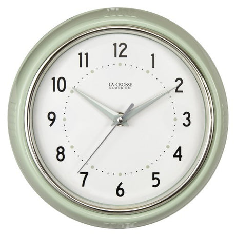 Vintage-inspired La Crosse wall clock with chrome bezel, Arabic numbers, and sweeping second hand in a retro diner style.