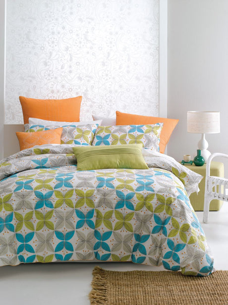 Double duvet set in white seersucker with orange trim and spot reverse, offering stylish comfort for a cozy bedroom.