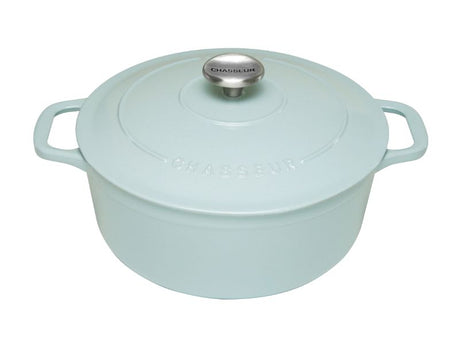 Round French oven in duck egg blue, perfect for searing and baking, with self-basting lid and artisan craftsmanship.