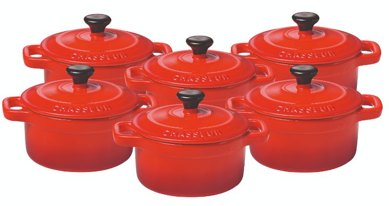 Set of six vibrant red mini cocottes for individual servings, perfect for baking, serving, and reheating in style.