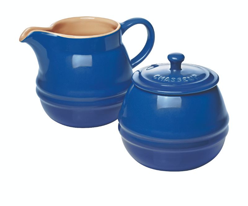 Elegant blue sugar bowl and creamer set, crafted from versatile stoneware, perfect for enhancing tea and coffee service.