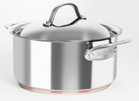 Elegant copper core casserole with domed lid, ideal for soups and stews, featuring ergonomic handles and stainless steel exterior.