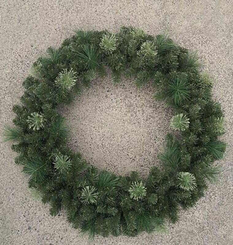 Lifelike 48" Flowering Pine Wreath featuring pine needles and floral accents, perfect for year-round home decor.